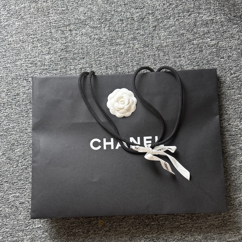CHANEL Black Bag with White Camellia